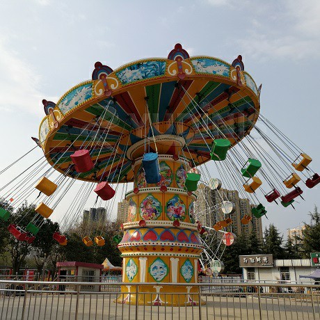 amusement park spin ride flying chair